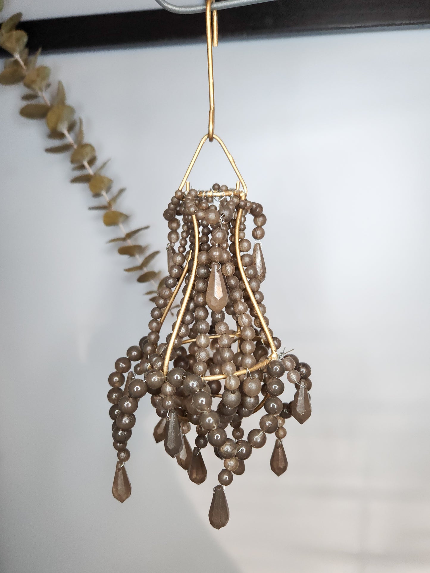 Hand-beaded taupe and gold chandelier ornament. 